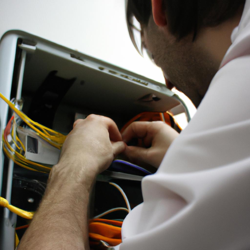 Person working on network equipment