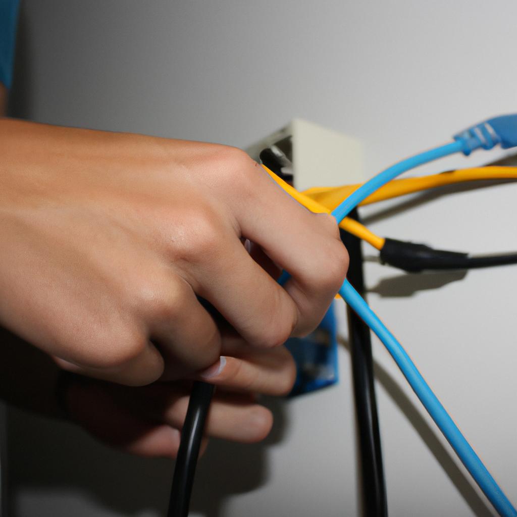 Person working with network cables